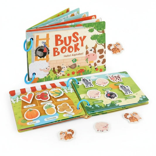 Children's busy book with farm animals and alphabet pages on a white background